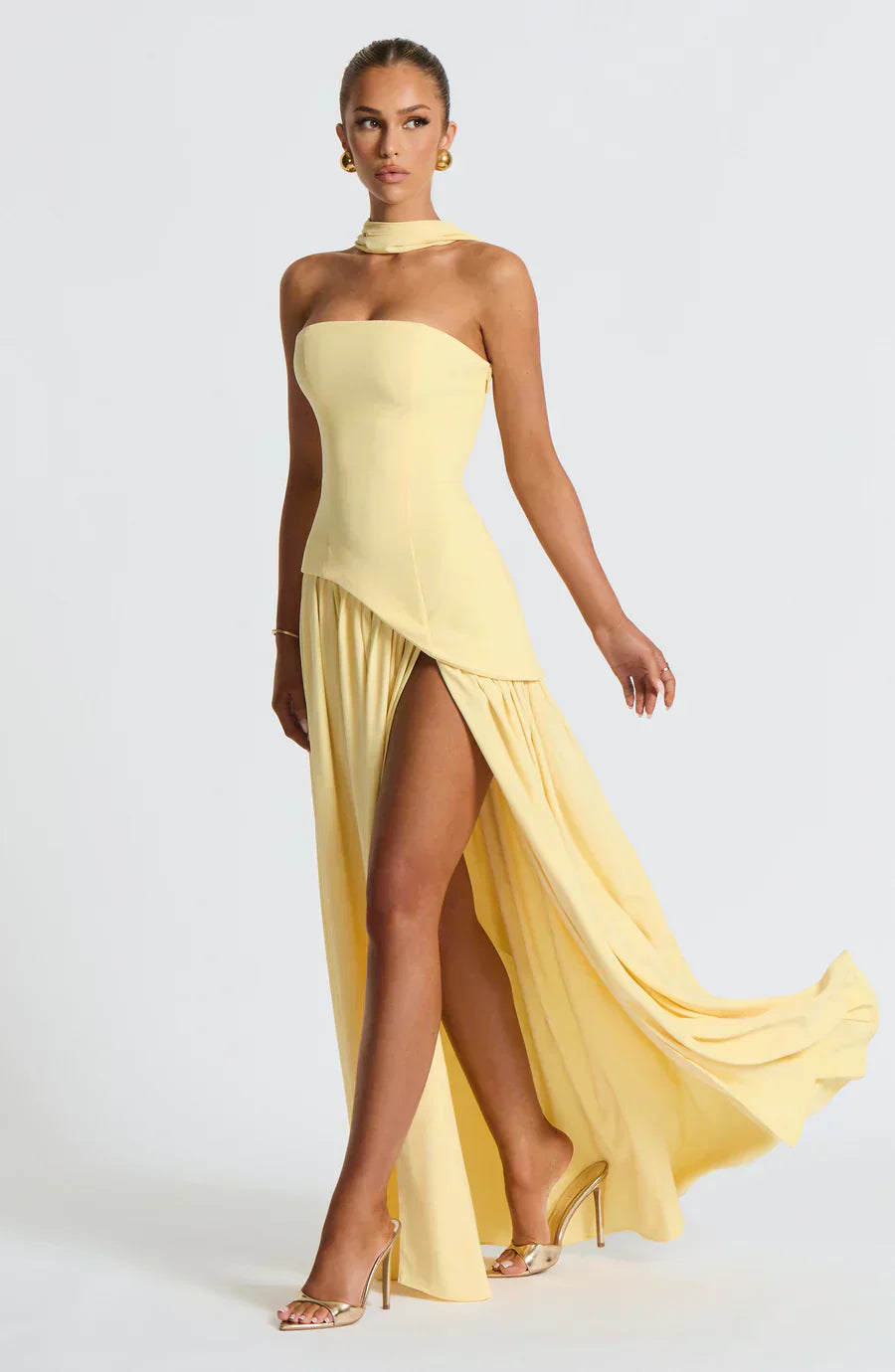 Elegant strapless maxi dress for women with a high slit & asymmetric hem, perfect for evening events.