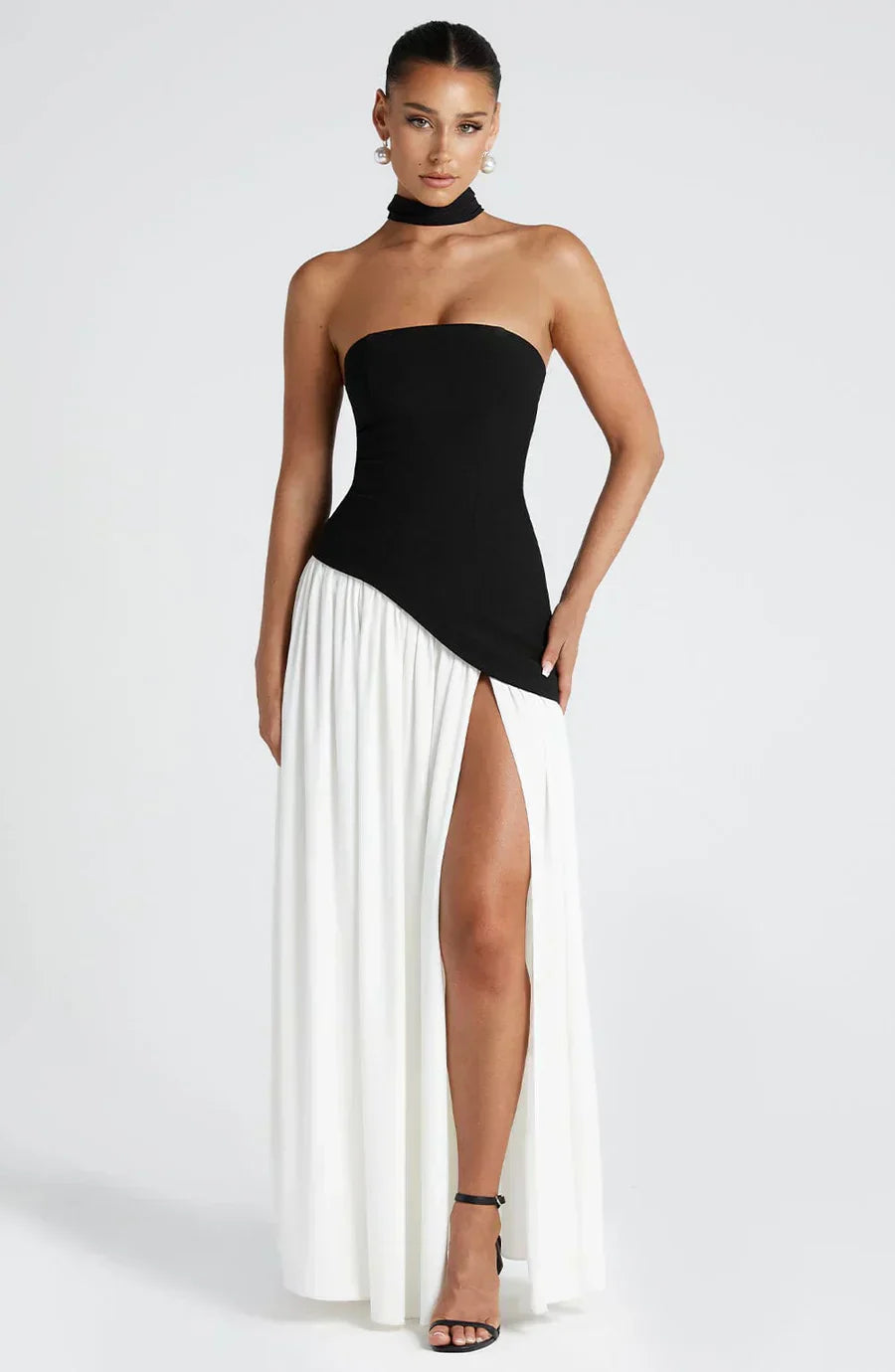 Chic strapless maxi dress for wedding guests, elegant design with a high slit.