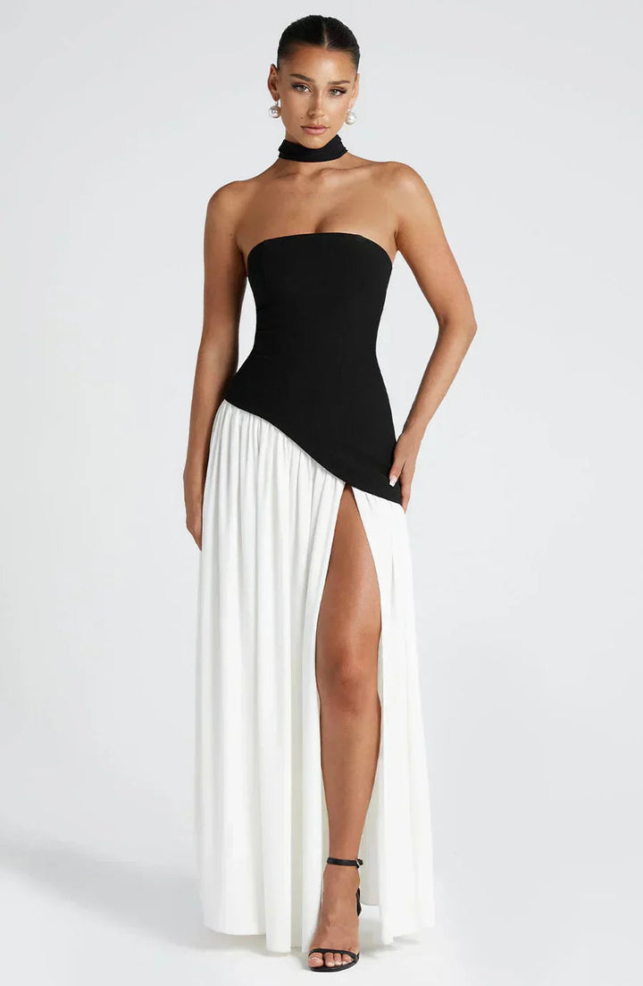 Chic strapless maxi dress for wedding guests, elegant design with a high slit.