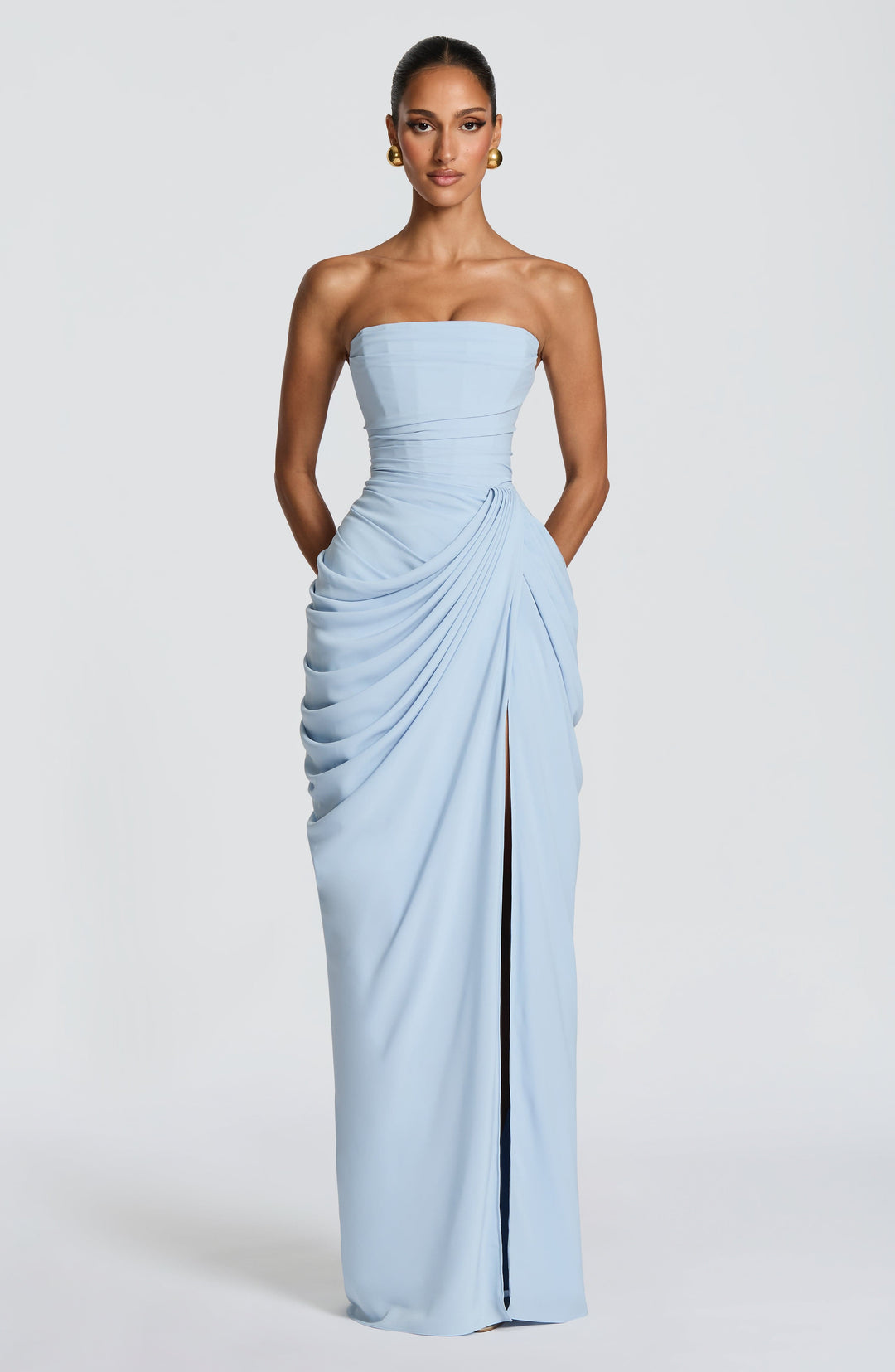 Light blue draped maxi gown, strapless, corset bodice, perfect for wedding guests.