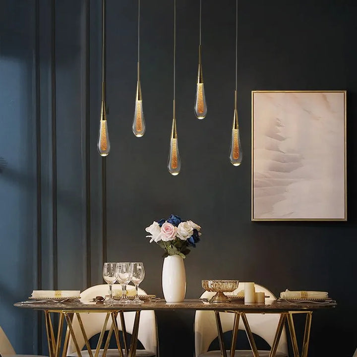 Artistic teardrop crystal pendant, a sophisticated modern lighting fixture for home interiors.