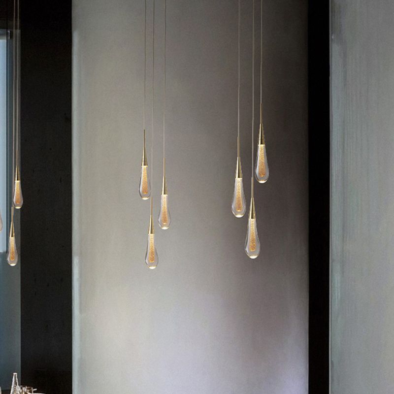 Sparkling teardrop crystal pendant light, elegant interior decor for contemporary homes.