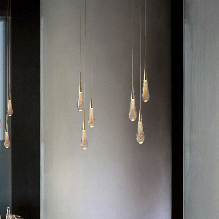 Sparkling teardrop crystal pendant light, elegant interior decor for contemporary homes.