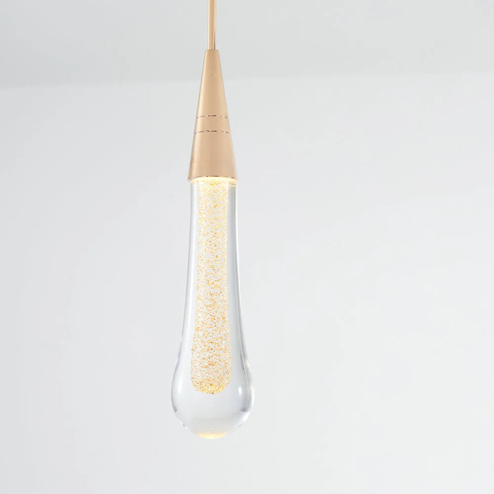 Luxury teardrop crystal pendant fixture, ideal modern lighting for bedroom or dining room.