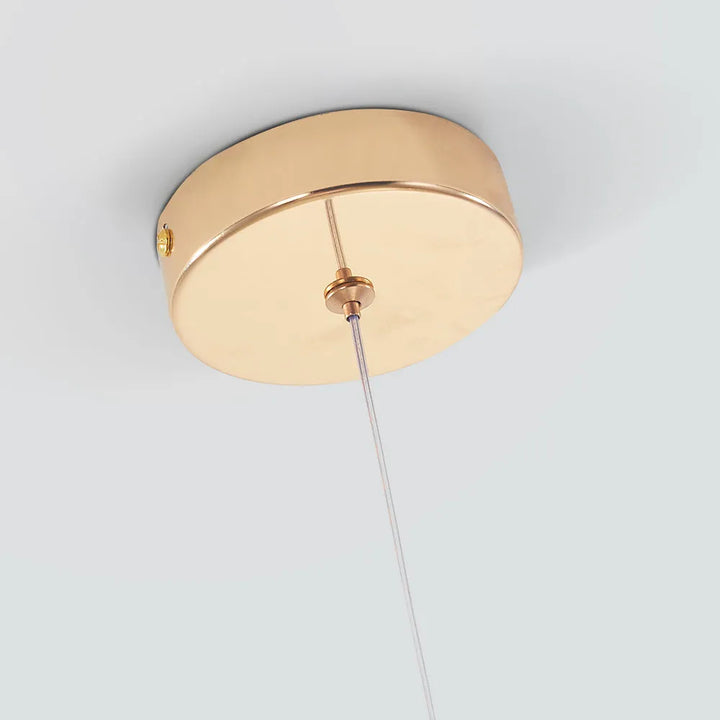 Stylish teardrop crystal pendant lamp, modern decor element for living room or entryway.