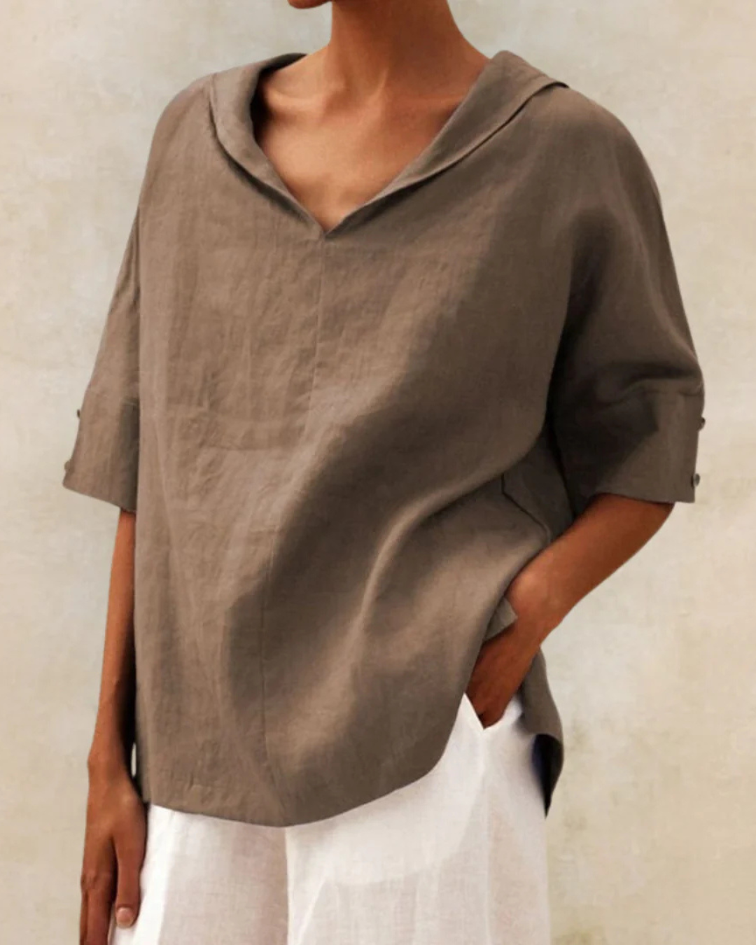 Elegant V-neck half sleeve women's blouse, ideal chic top for versatile spring fashion or everyday wear.