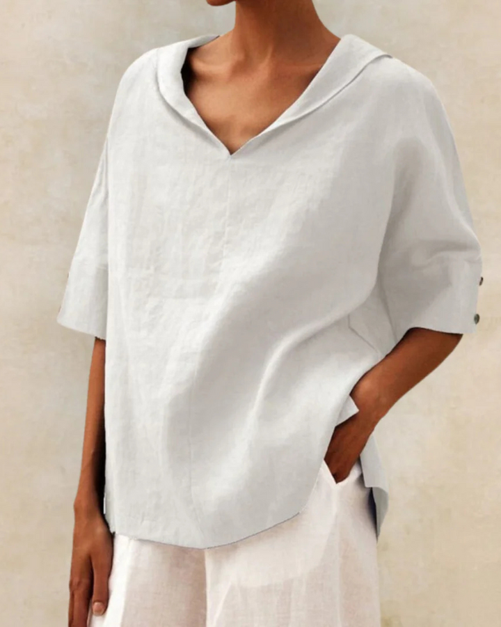 Chic women's V-neck half sleeve top, an elegant versatile blouse for spring fashion and casual summer wear.
