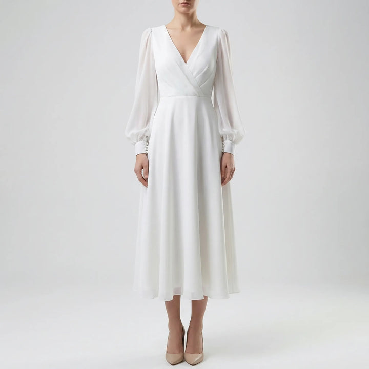 Vintage-inspired flowing wedding dress with delicate long sleeves