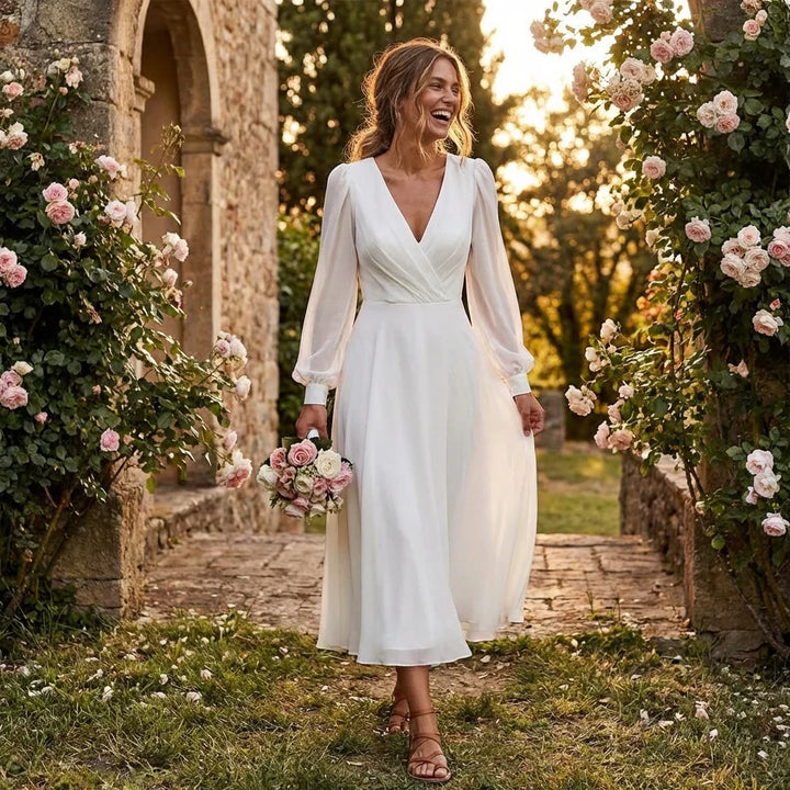 Plus size wedding dress with a graceful V-neck and flowing long sleeves