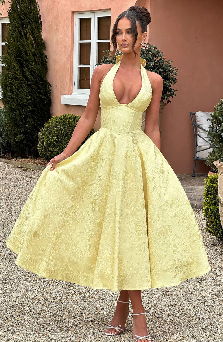 Classic women's V-neck midi dress, exuding elegant style. Comfortable & chic for wedding guests and summer occasions.