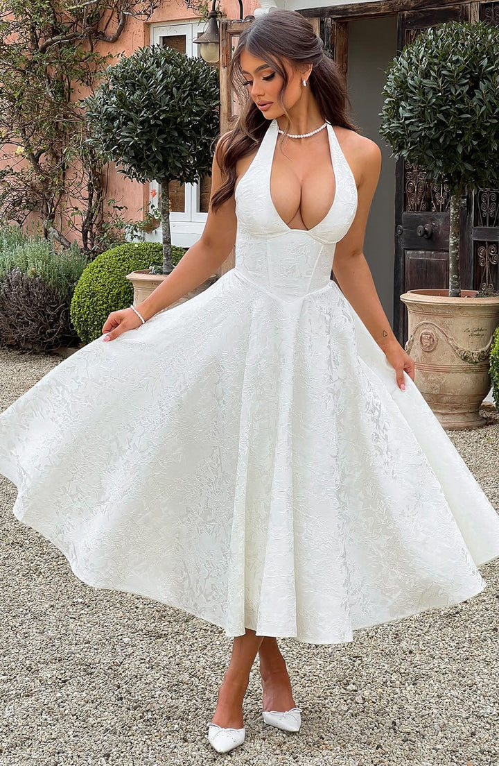 Women's elegant V-neck midi dress. Flattering wedding guest attire, perfect for summer parties & stylish events.