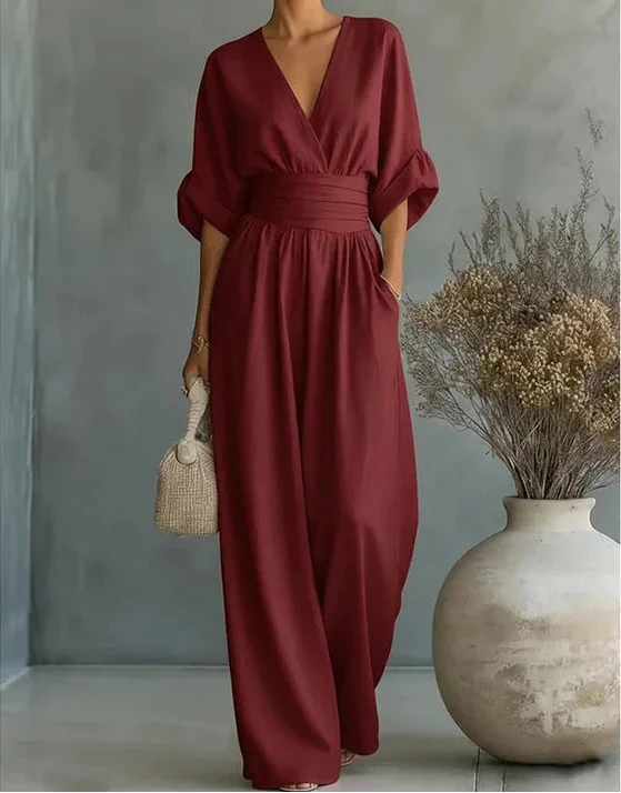 Elegant V-neck wide-leg jumpsuit in classic black, a timeless versatile one-piece for women.