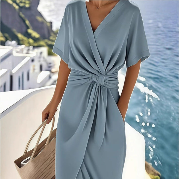 Women's summer wrap dress with a chic V-neck. Versatile and elegant for any occasion.