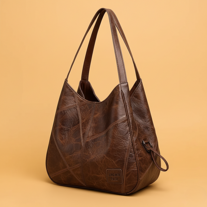 Stylish women's vintage leather bag collection, featuring a large tote, crossbody, and small wallet.