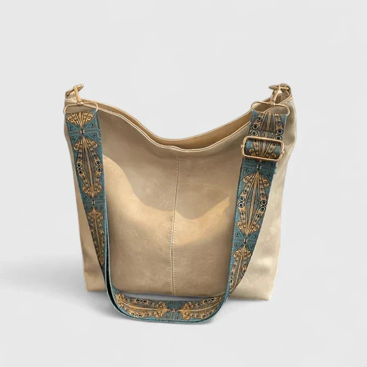 Elegant vintage-style women's shoulder handbag. Sophisticated daily use fashion accessory with ample space.