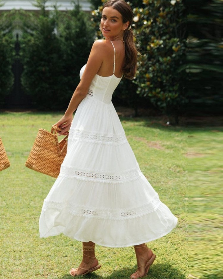 Romantic white lace panel maxi dress for women with spaghetti straps, a versatile boho summer or holiday outfit.