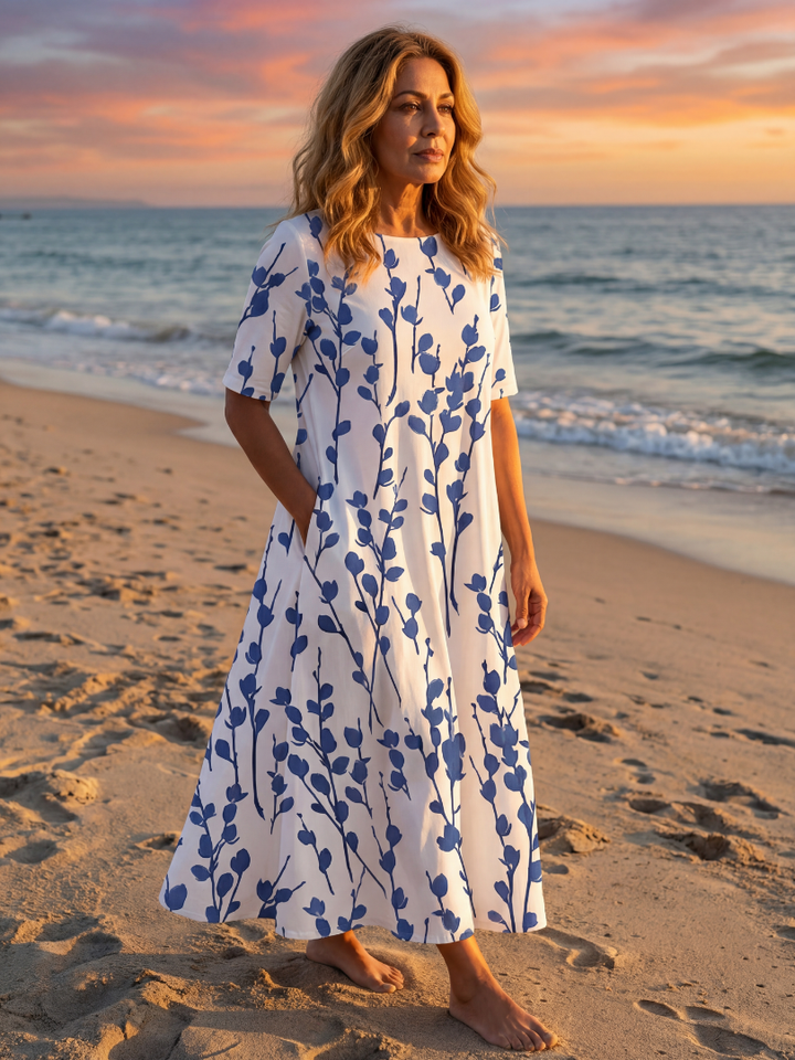 Elegant white floral midi dress for women, perfect for summer casual wear or day events. Features short sleeves & A-line cut.