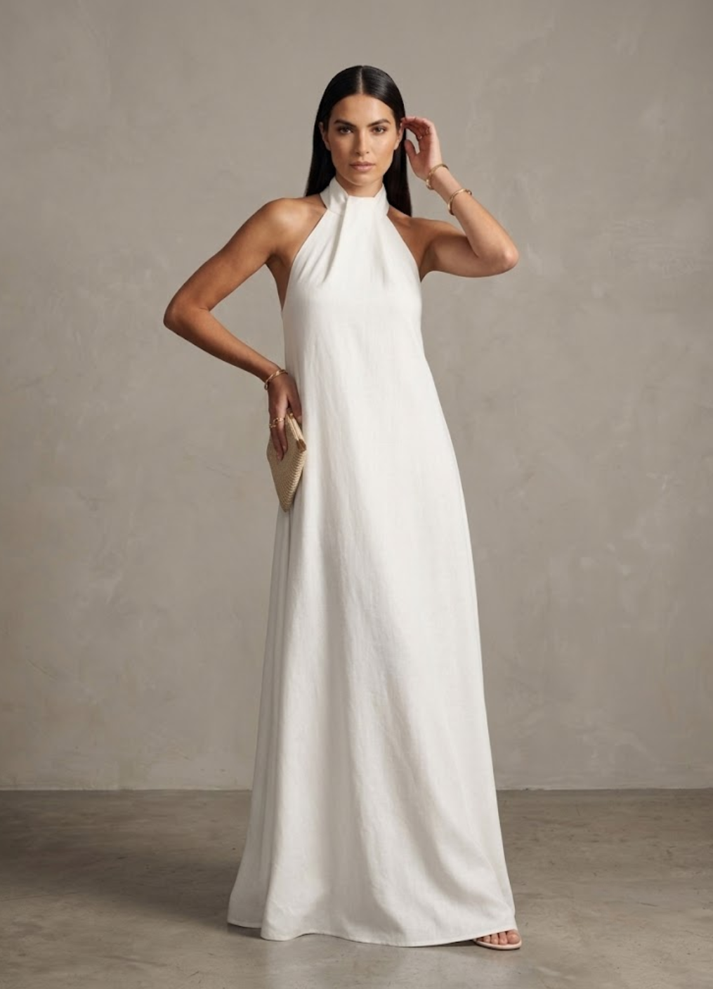 Flowing white halter neck maxi dress, ideal for women's elegant summer events, resort, or beach wedding guest attire.