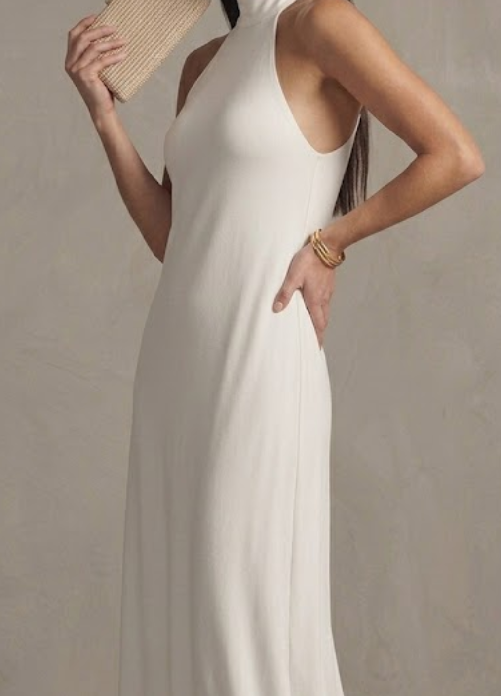 Stylish white halter neck maxi dress for women, perfect elegant occasion wear, a summer dress, or wedding guest outfit.