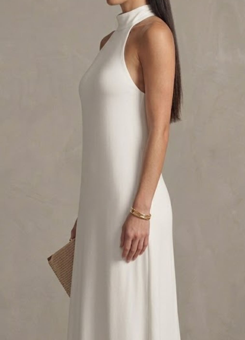 Beautiful white halter neck maxi dress, a flowing and elegant choice for women's summer events, resort, or wedding guests.