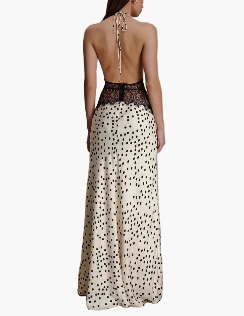 White polka dot halter neck maxi dress for women, featuring delicate lace. Elegant & comfortable for summer parties.