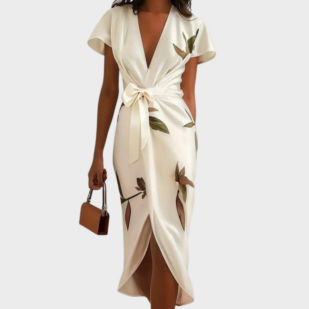 Flowy light blue leaf print wrap V-neck dress for women, featuring flutter sleeves, ideal for wedding guests.