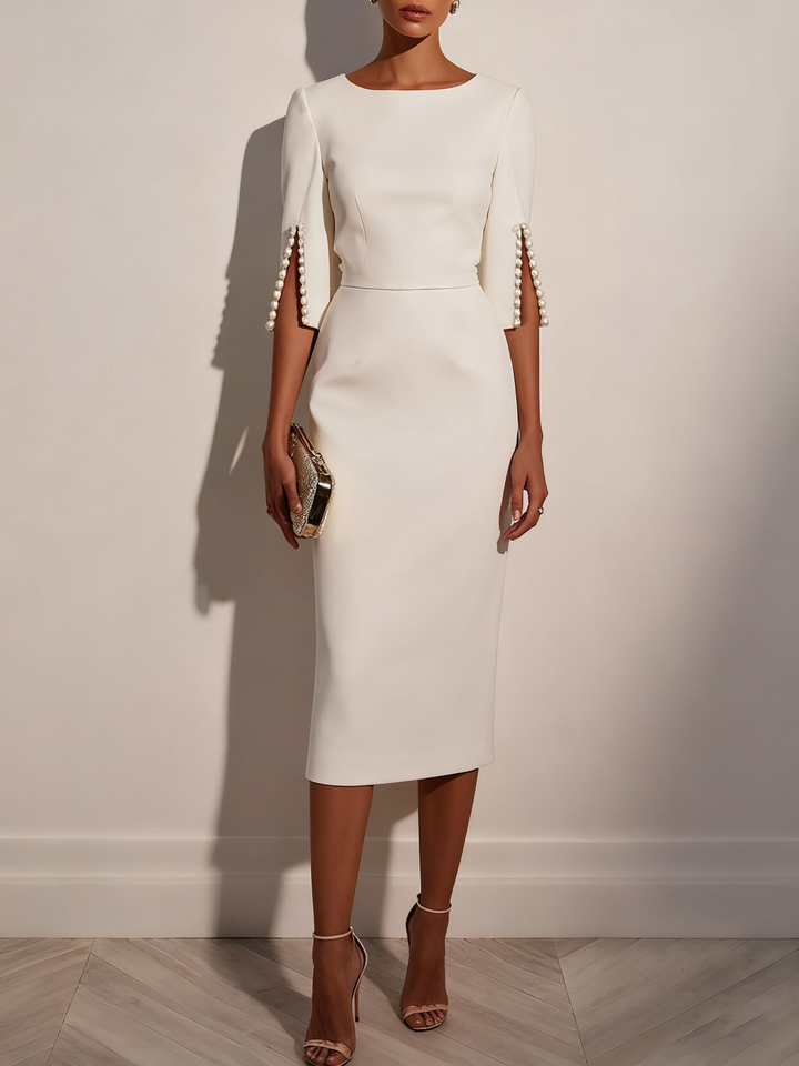 Sophisticated pearl detail midi dress, a stunning choice for wedding guests.