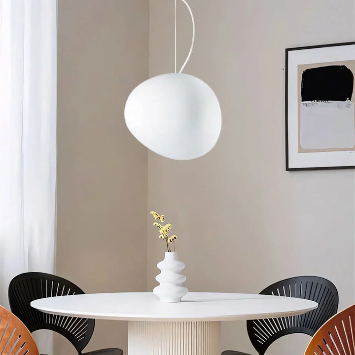 Modern white pebble pendant light for ceiling, minimalist indoor lighting fixture.