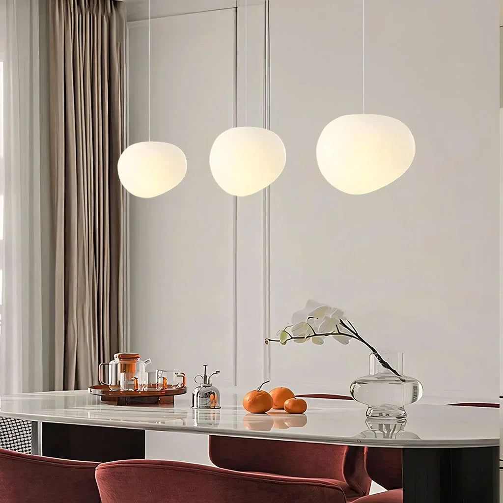 Chic white pebble pendant light, minimalist design for modern home decor & ambient lighting.