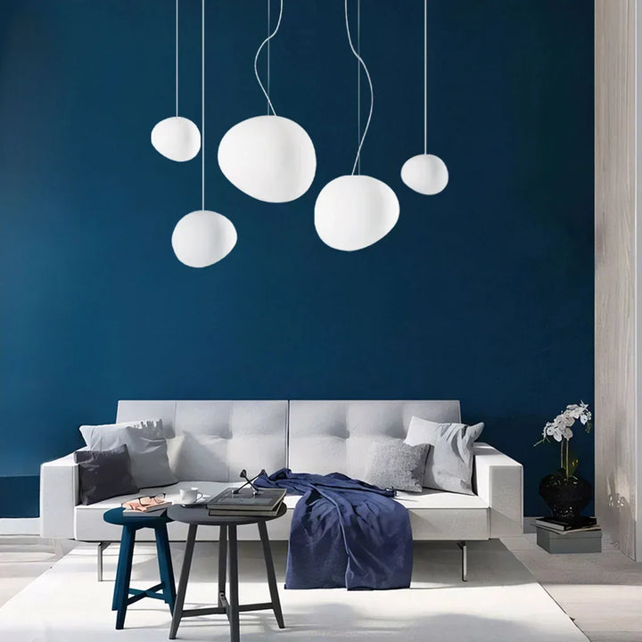 Elegant white minimalist pebble pendant light. Modern ceiling lamp for indoor decor.