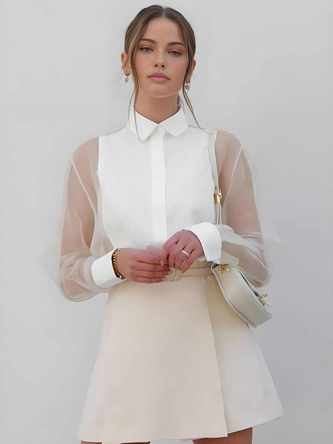 Women's professional white collared blouse with elegant sheer long sleeves and button front. Perfect for office fashion.