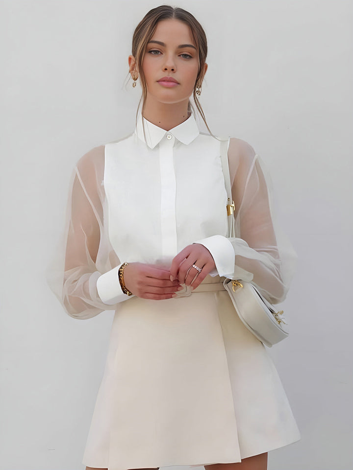 Women's professional white collared blouse with elegant sheer long sleeves and button front. Perfect for office fashion.