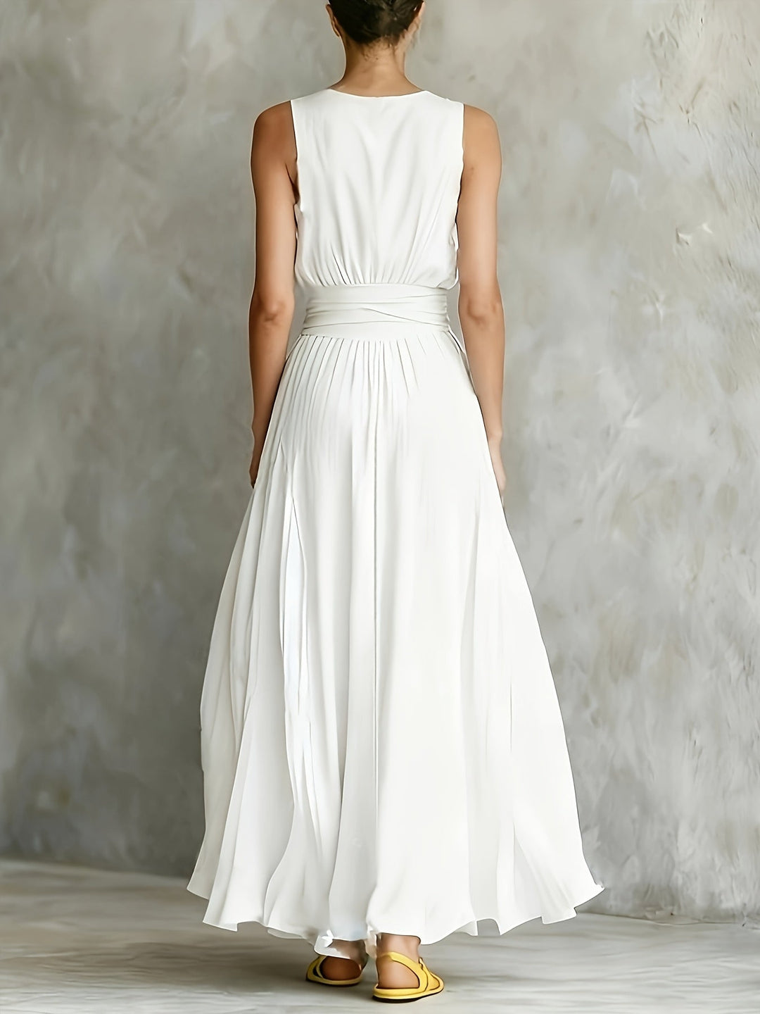 Sleeveless A-line white maxi dress for women with an elegant design and adjustable belt, suitable for various occasions.