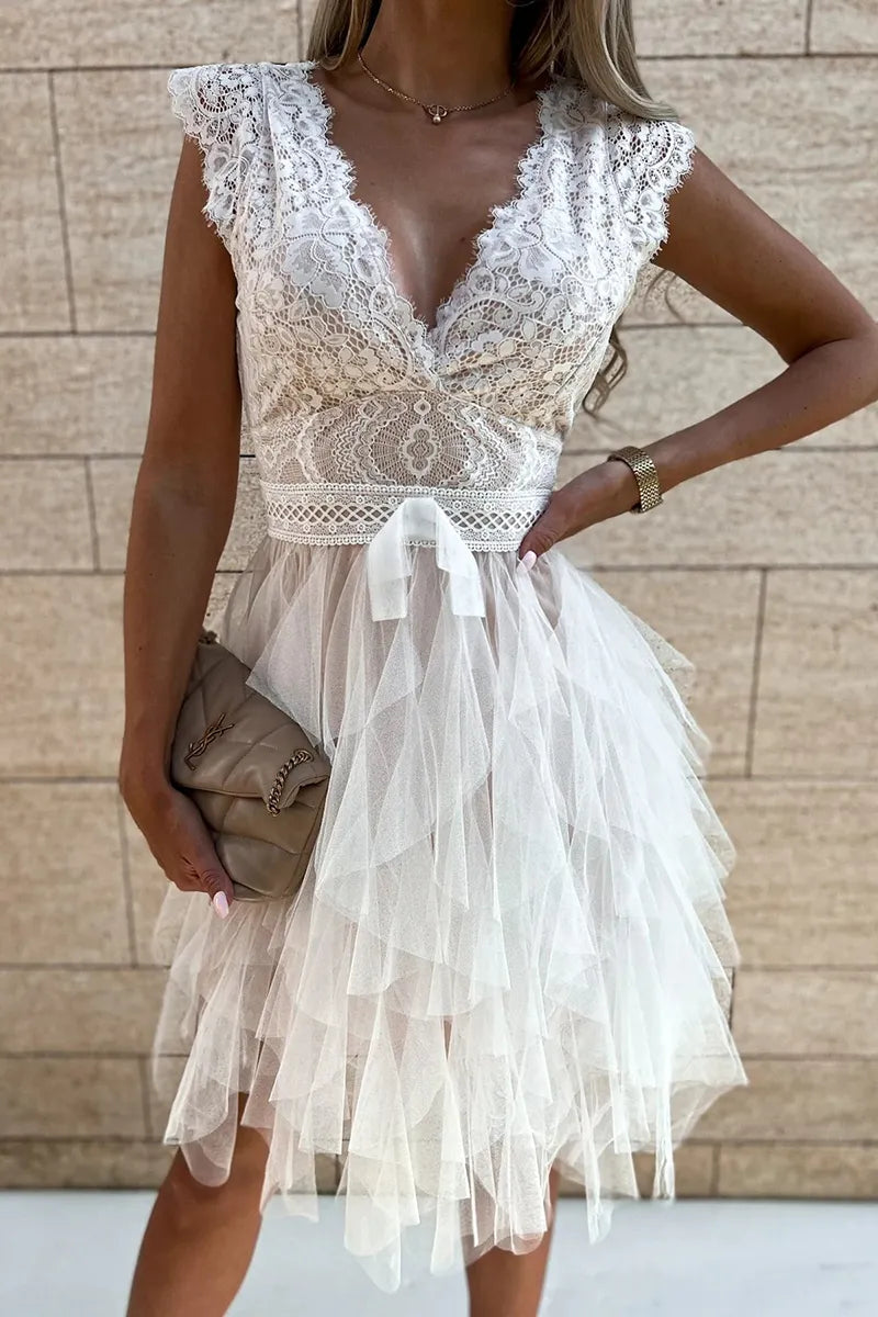 Chic women's mini cocktail dress featuring delicate ruffles and a flattering flared skirt.
