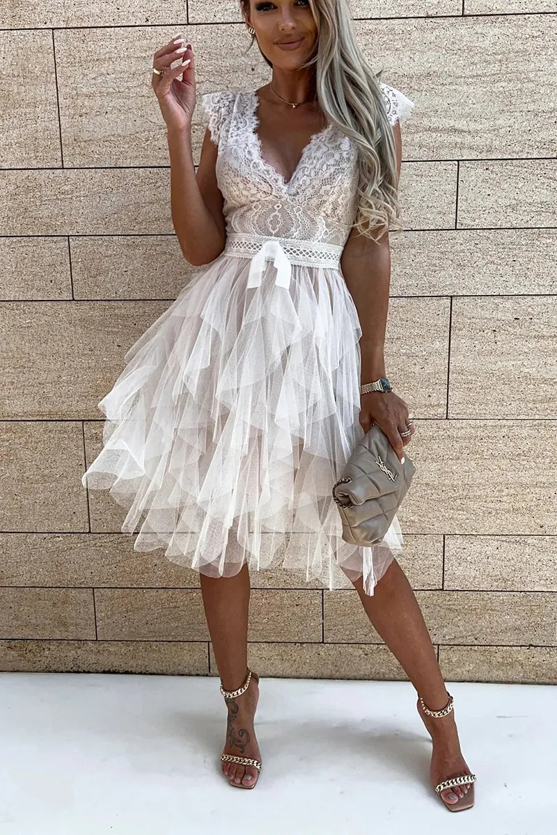 Fashionable women's ruffle mini dress in white, ideal for cocktail parties and special occasions.