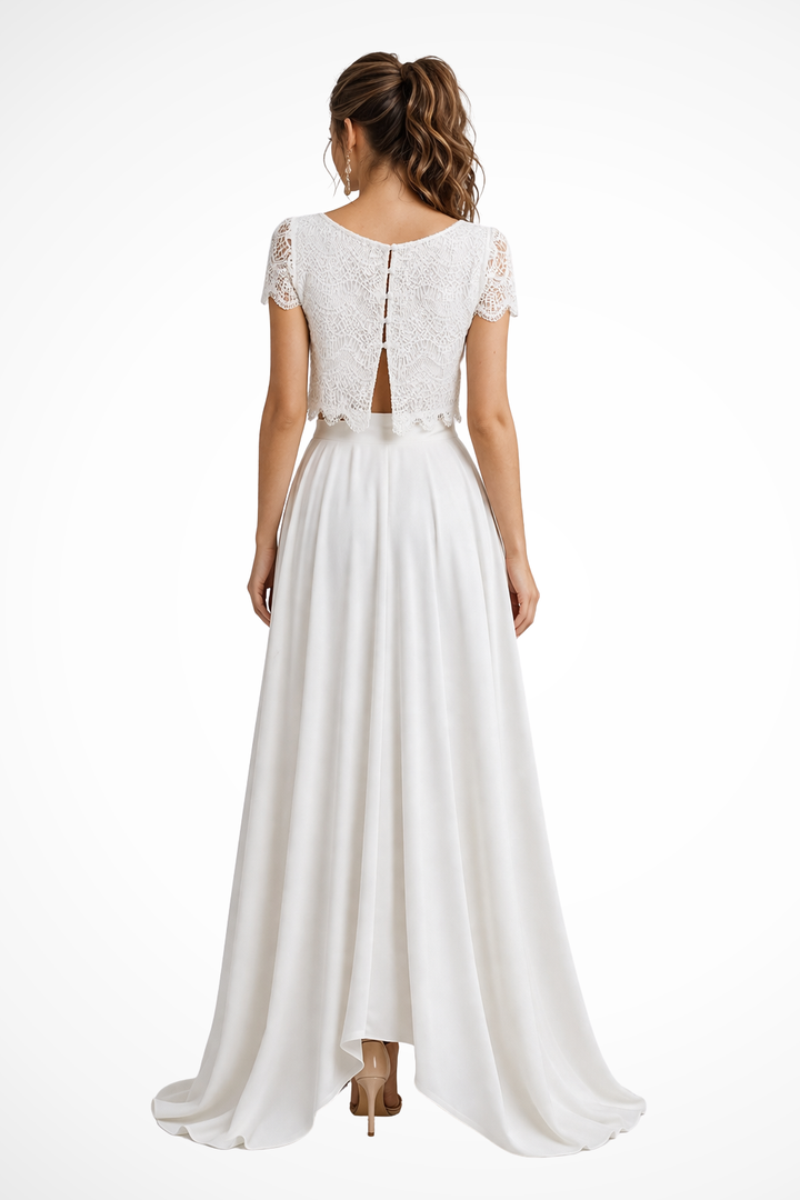 Women's sophisticated white two-piece set featuring a stylish top and flowing maxi skirt for formal events.