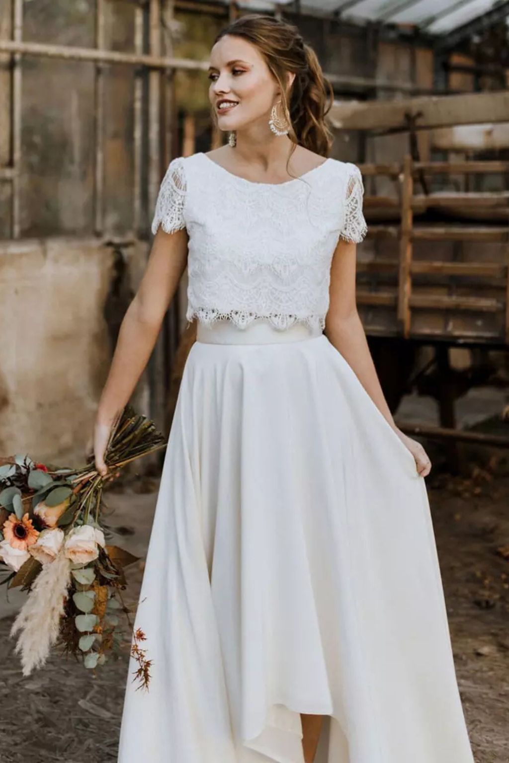Women's elegant white two-piece set with a chic top and long maxi skirt, perfect for formal or special occasions.