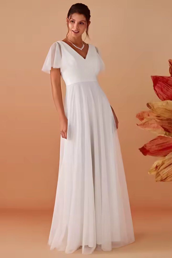 Close-up of the V-neckline and sheer flutter sleeves on a women's elegant white maxi dress, special occasion.