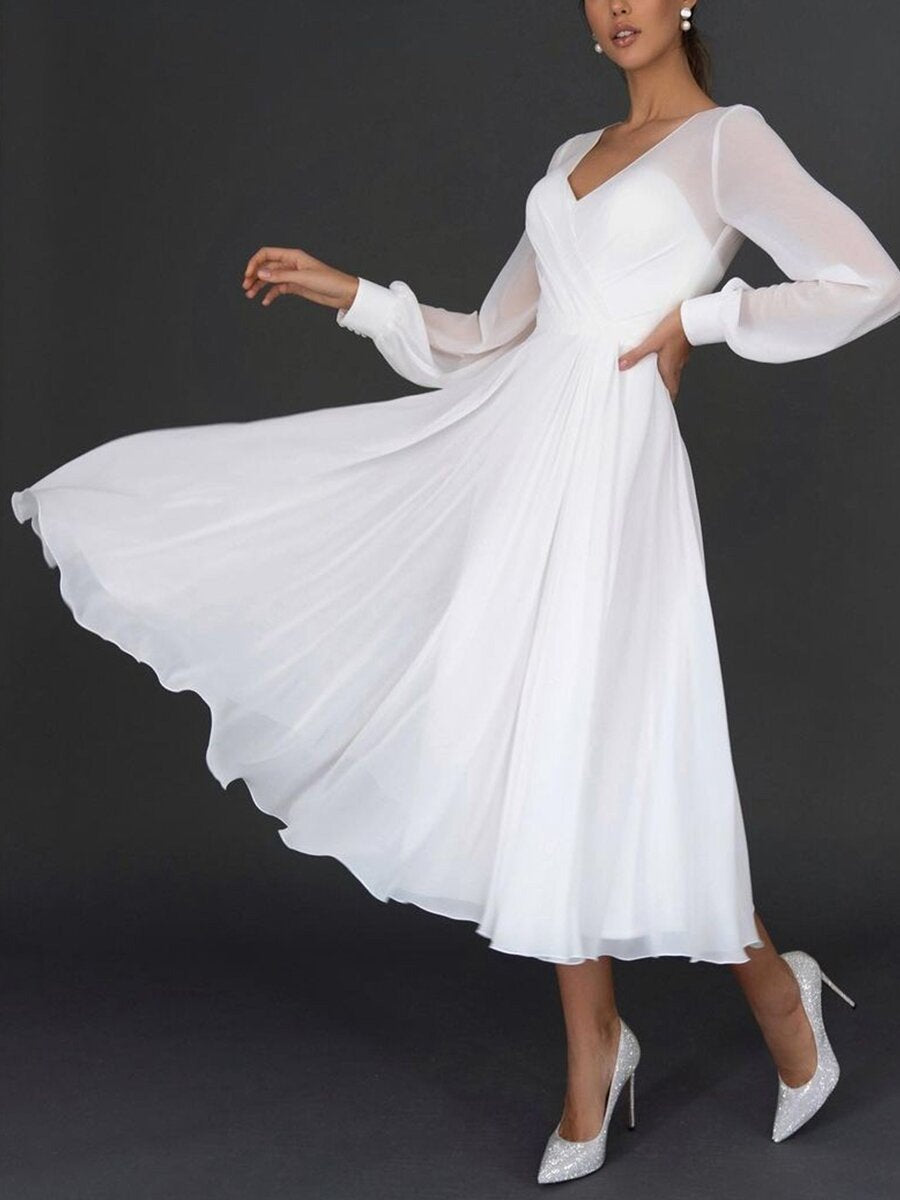 Formal white V-neck midi dress with long sleeves & pleated skirt, designed for women seeking an elegant special occasion outfit.