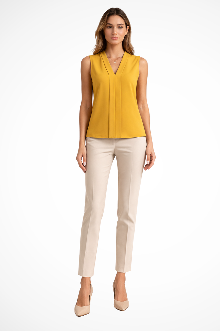 Beige women's V-neck sleeveless blouse. Smart casual and versatile layering top with an elegant front pleat.