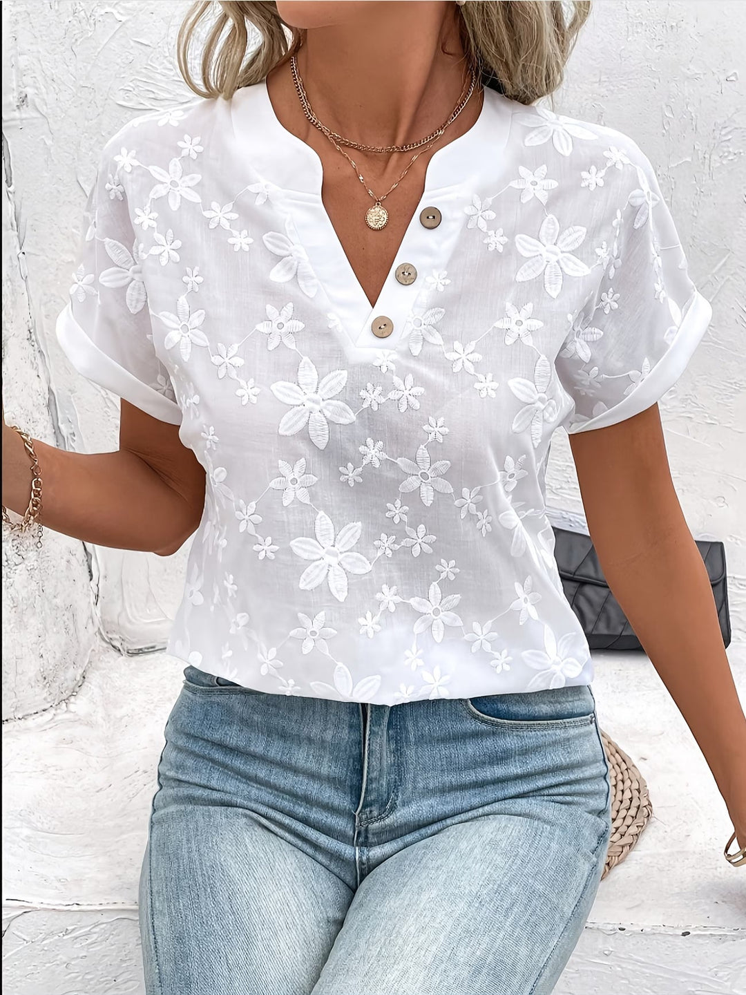 Elegant white women's floral button-up shirt with long sleeves, perfect for spring casual or workwear fashion.