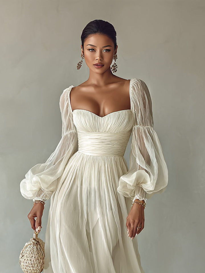 Flowy white long sleeve maxi dress for women with elegant square neck. Comfortable for casual or evening wear.