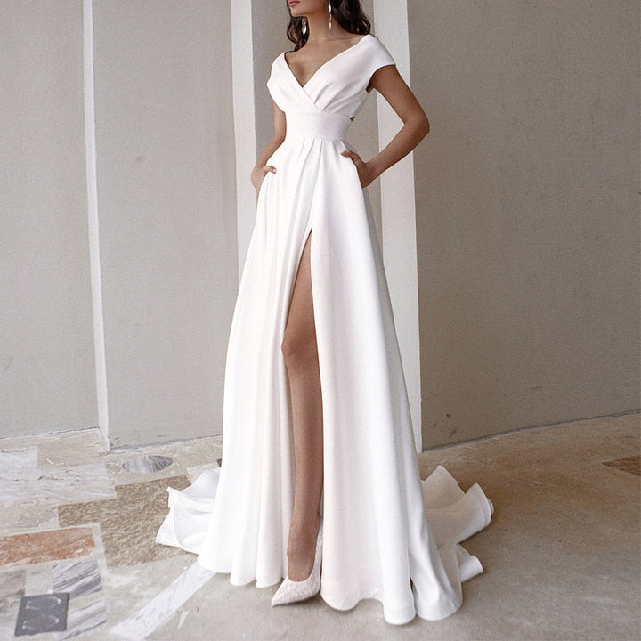Elegant white women's V-neck floor-length evening dress with a high slit, perfect for formal occasions & parties.