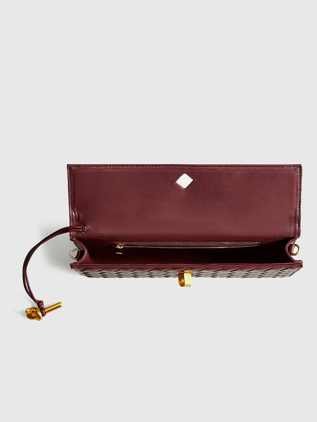 Chic wine red woven flap shoulder bag for women. Elegant versatile handbag with detachable strap & sleek design.