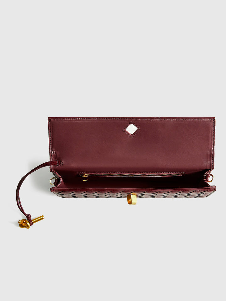 Chic wine red woven flap shoulder bag for women. Elegant versatile handbag with detachable strap & sleek design.