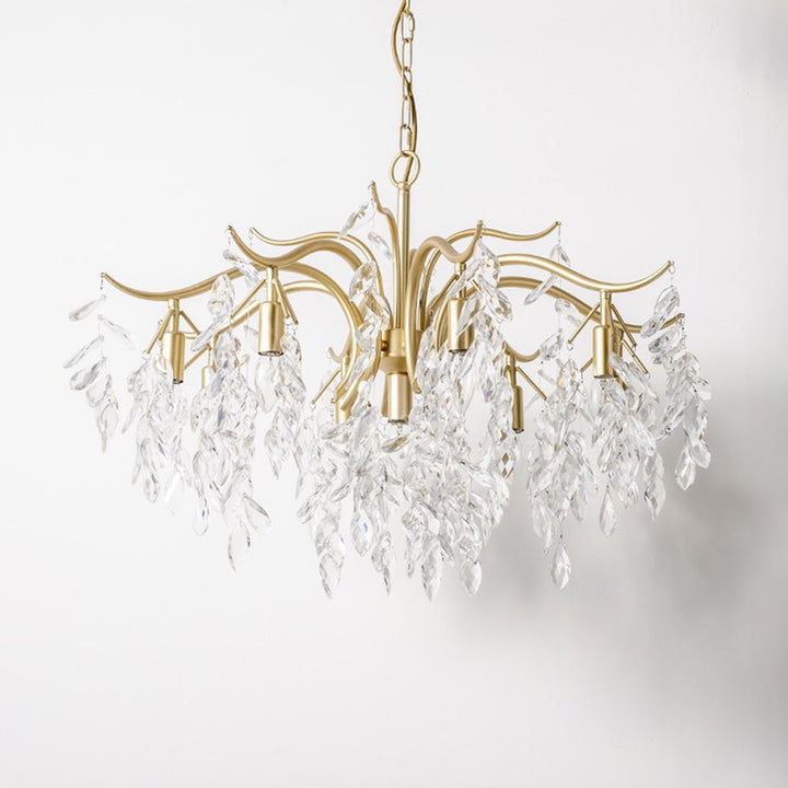 Elegant wisteria crystal chandelier illuminating a dining room, modern luxury home decor lighting.
