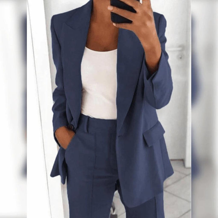 Formal women's suit set. Stylish blazer & tailored trousers for business meetings & special events.