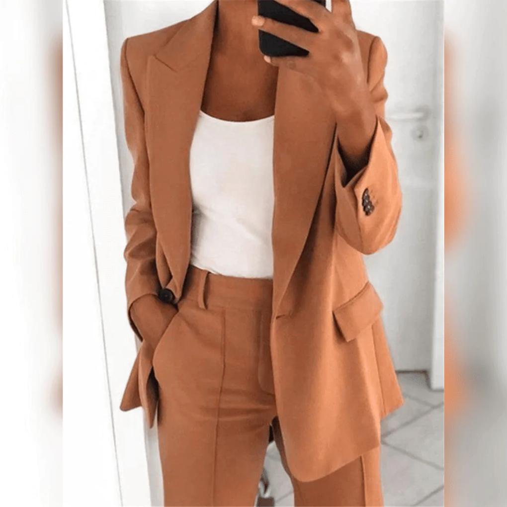 Complete women's business attire. This elegant 2-piece suit includes a blazer and tailored trousers.