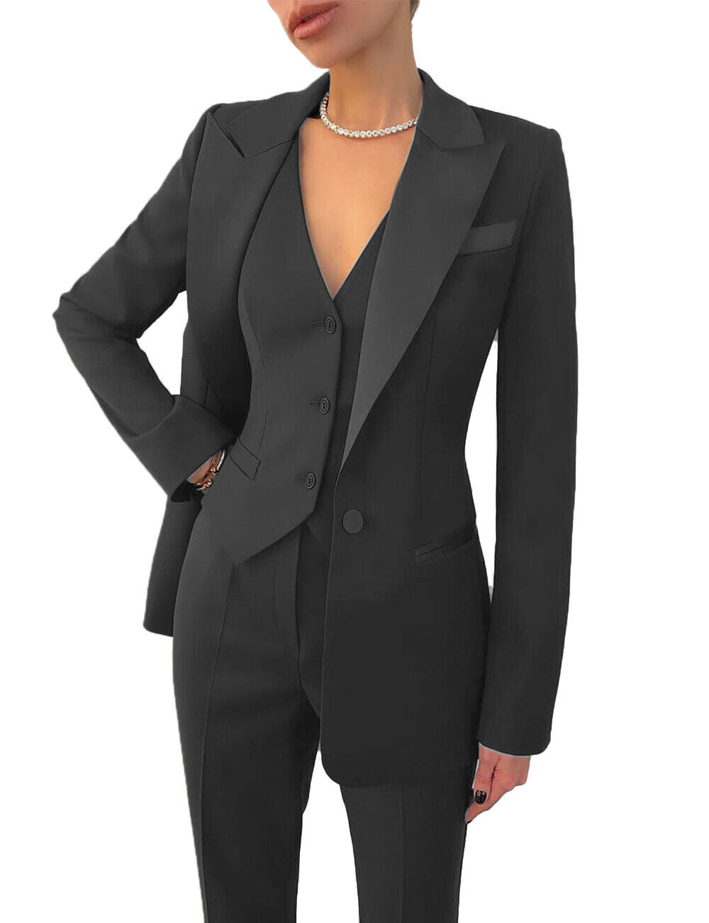 Women's business suit with tailored blazer, vest & matching trousers. Elegant professional wear.