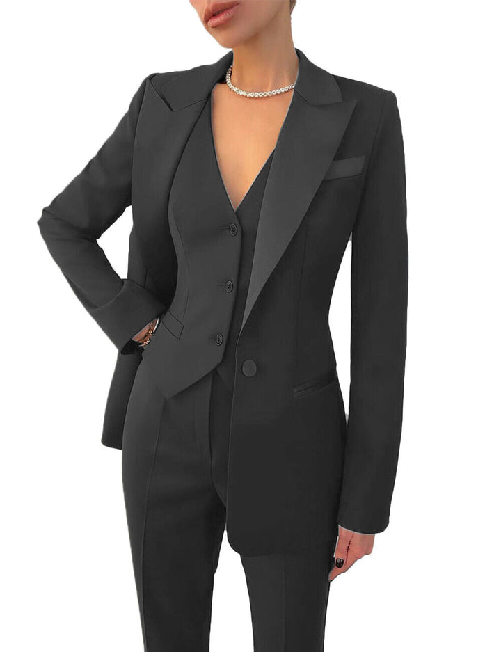 Women's business suit with tailored blazer, vest & matching trousers. Elegant professional wear.